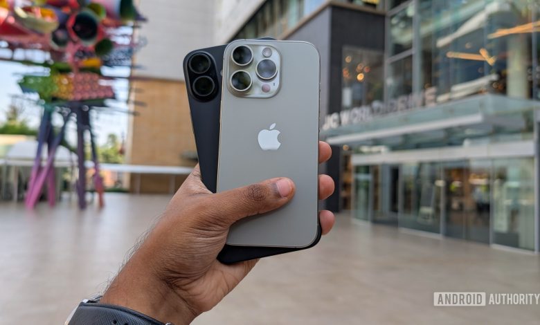 Apple iPhone 16 Plus in black color and iPhone 16 Pro in Natural Titanium color held out in hand