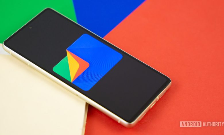 Google Files app logo on smartphone with manila folder and colorful background Stock photo 5