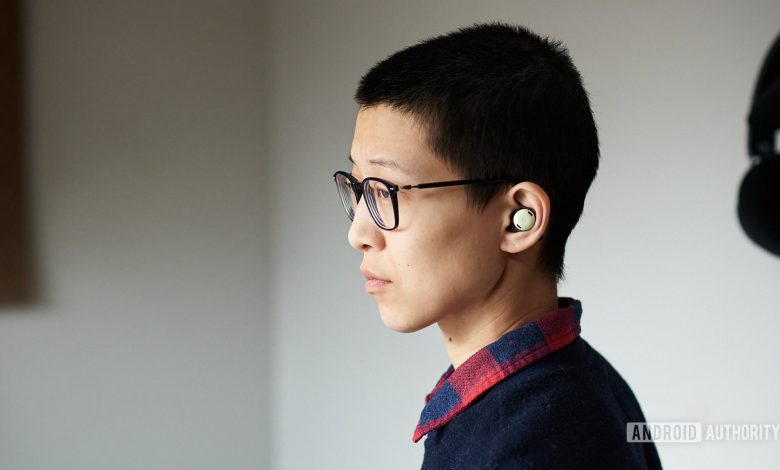 A person wears the Google Pixel Buds Pro.