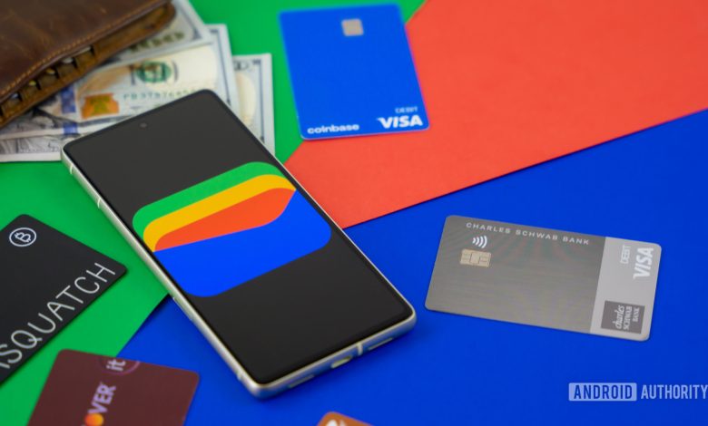 Google Wallet logo on smartphone next to credit cards and cash Stock photo 1