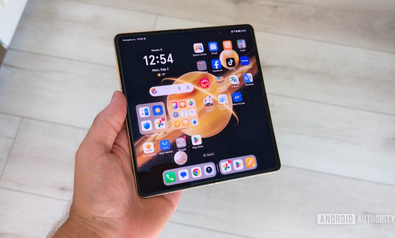 HONOR Magic V3 Unfolded in hand showing home screen on inner display