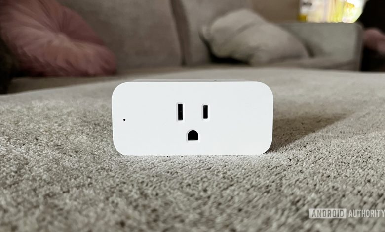 A beauty shot of the Amazon Smart Plug on a couch