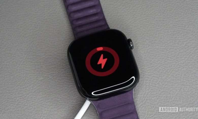 An Apple Watch Series 10 with low battery charges on its fast charging cable.