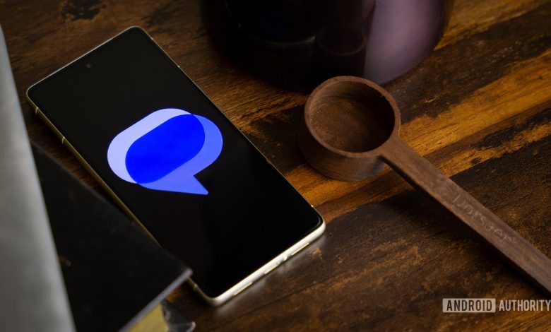 Google Messages logo on smartphone laying on table (1)