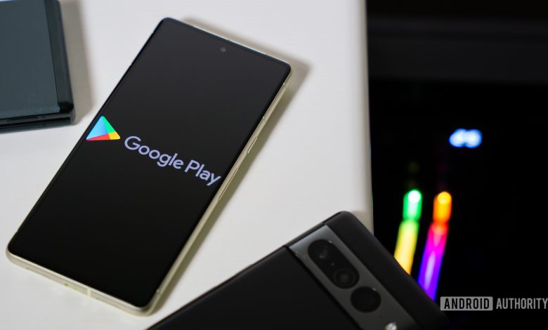 Google Play Store logo on smartphone stock photo.