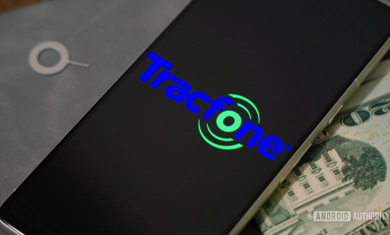 Tracfone logo on smartphone, next to cash and SIM ejector tool (1)