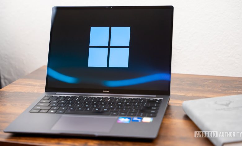 Windows logo on laptop stock photo (16)