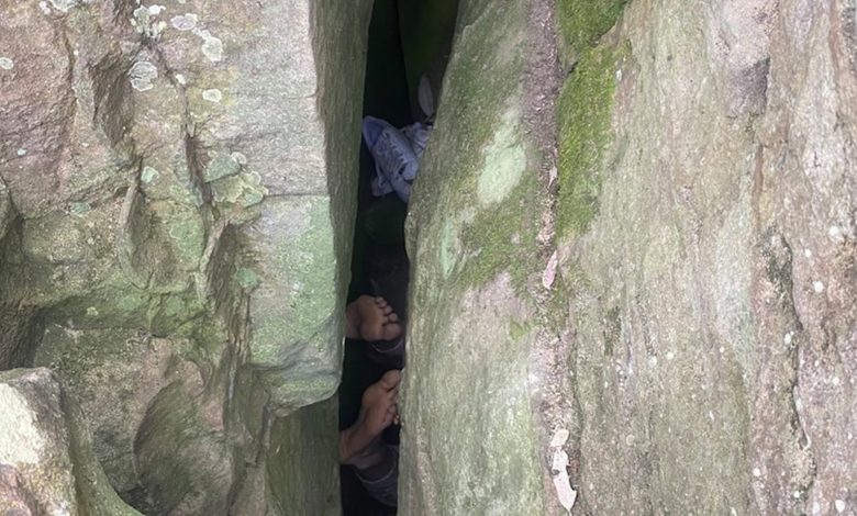 Woman hangs by her feet after attempting to save her dropped phone.