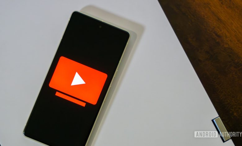 YouTube TV logo on smartphone stock photo (3)