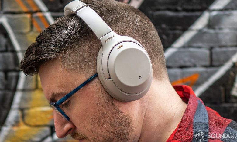 A photo of a man wearing Sony WH-1000XM3 headphones.