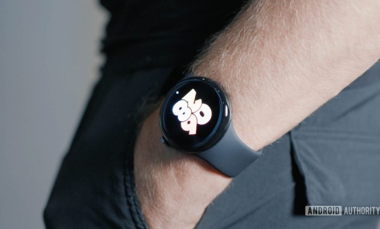 A man wearing a Google Pixel Watch 3 with his hands in his pocket.