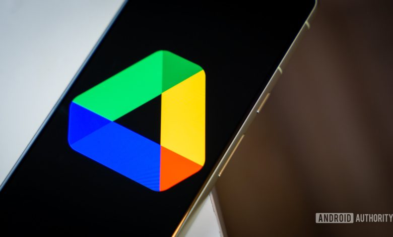 Google Drive logo on smartphone laying on desk Stock photo 2