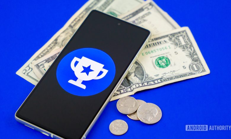 Google Opinion Rewards logo on smartphone next to money Stock photo 2