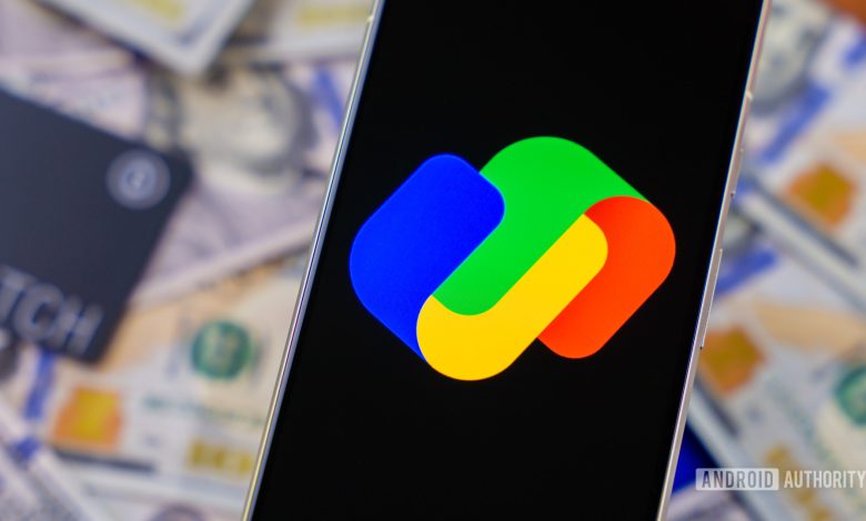 Google Pay logo on smartphone next to money and cards Stock photo 1