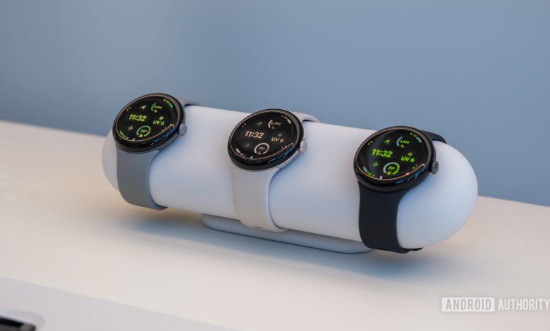 A selection of Google Pixel Watch 3s rest on a stand.