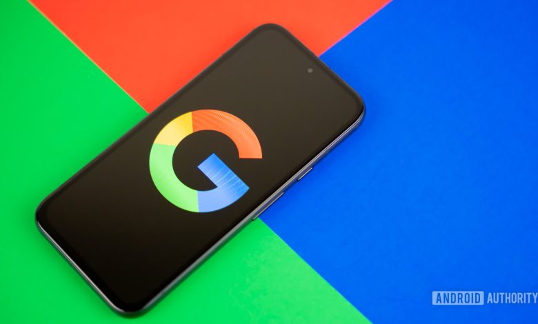 Google or Google Search logo on smartphone, with colorful background stock photo (4)