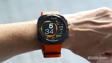 A Samsung Galaxy Watch Ultra displays the MD323 watch face