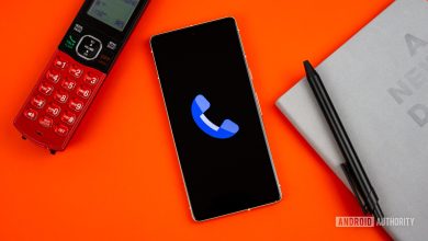 Stock photo of Phone by Google app on phone next to home phone agenda and pen 1