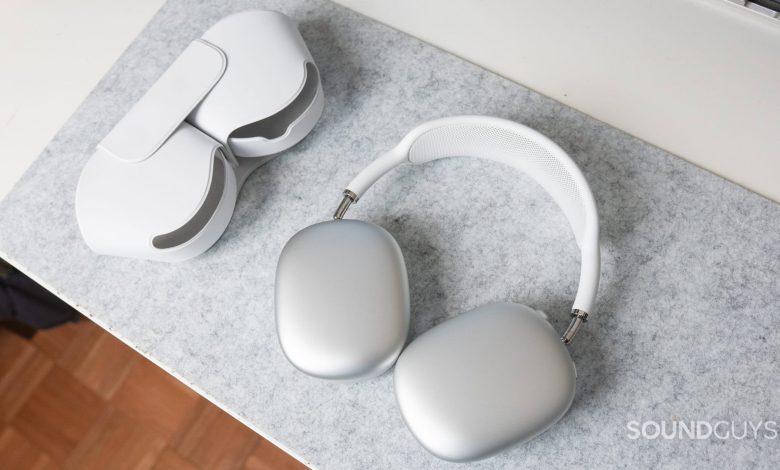 The Apple AirPods Max and its smart case on a white desk.