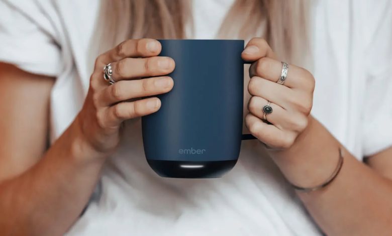 Ember Mug 2 in blue in hands