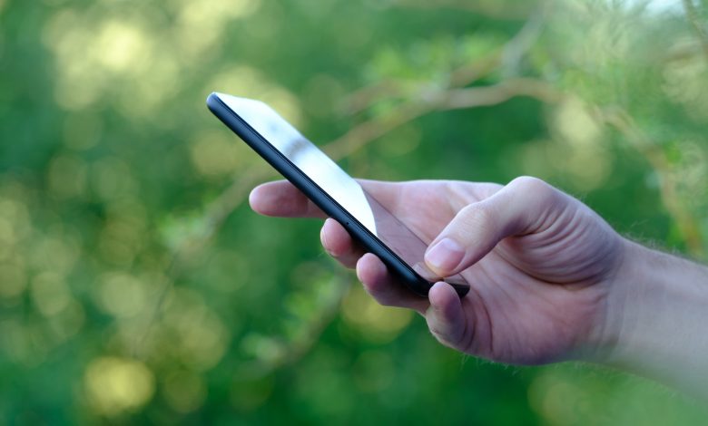 Google Pixel 4a holding phone showing side