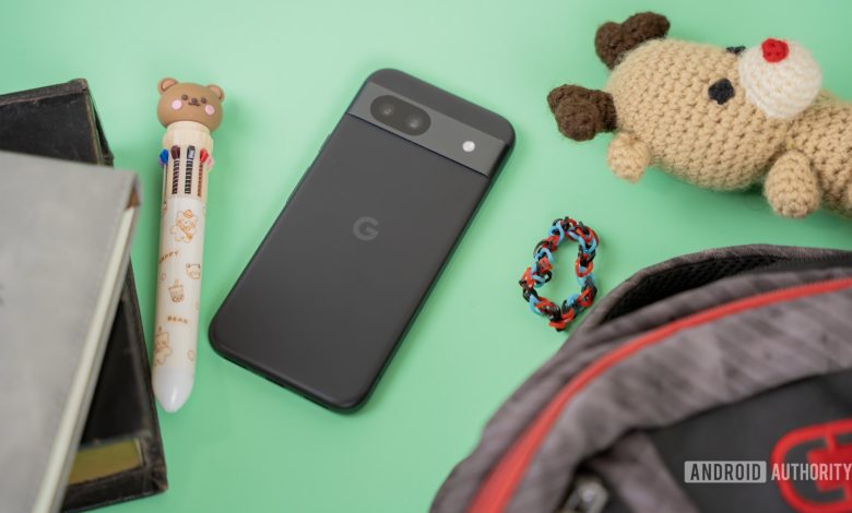 Smartphone next to kid school and random accessories 2