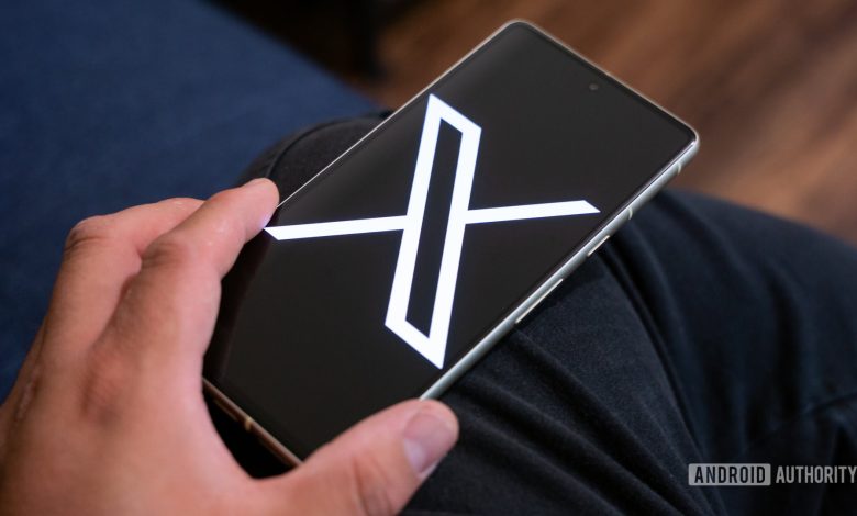 X logo on smartphone stock photo (aka Twitter) (4)