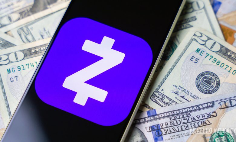 Zelle logo on smartphone with cash on background stock photo (2)