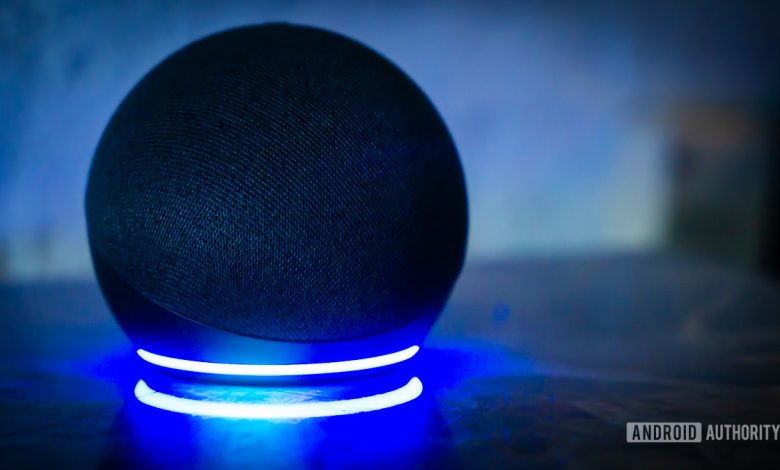 Amazon Echo Dot Alexa speaker with light ring turned on stock photo 1