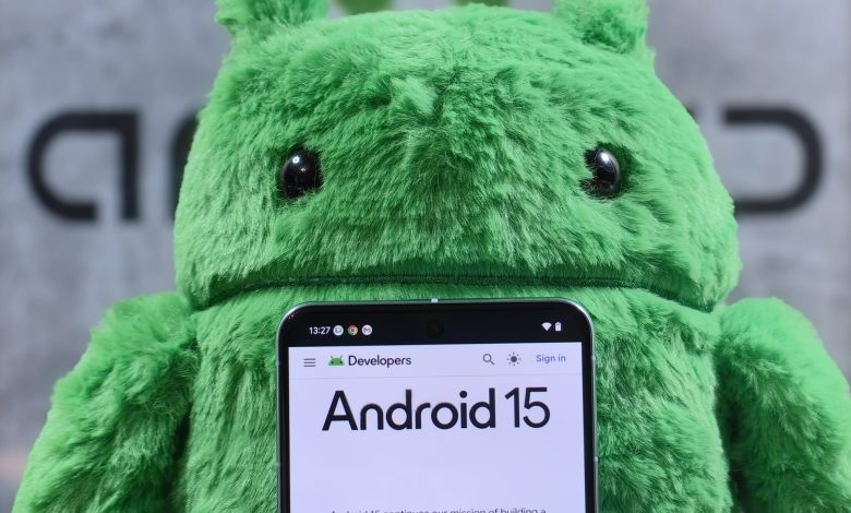 Pixel 8 Pro in front of an Android plushie