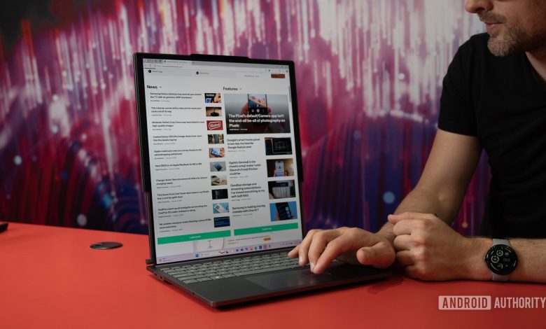 Lenovo ThinkBook Plus Gen 6 Rollable unrolled with hand on trackpad